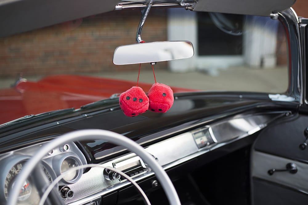 Fuzzy dice hanging from a rearview mirror